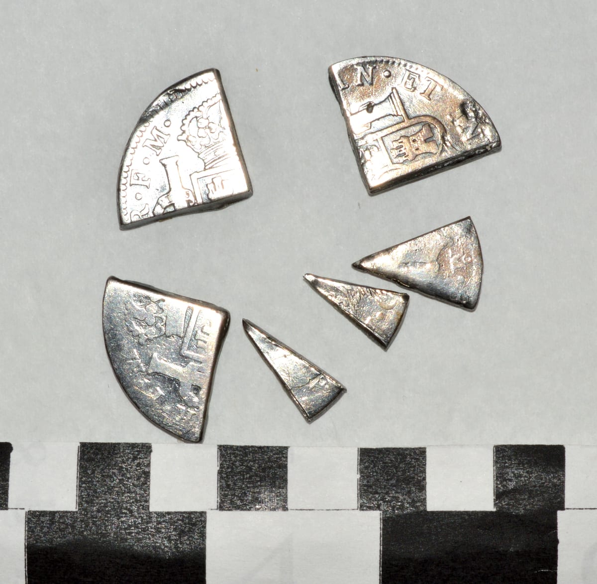 A Spanish 8 reales coin with the cut wedges, or bits, that gave the piece of eight its name